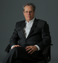 Middle-aged man in suit and glasses